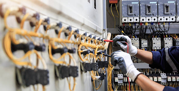 Professional Electrician technician working in Lone Tree, IA